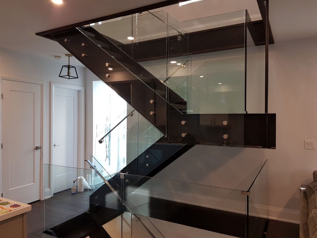 modern floating stairs with glass railings
